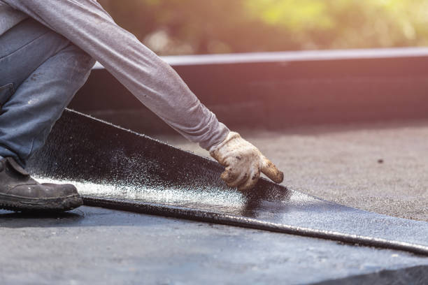 Professional Basement Waterproofing technician working in Lewis, IN